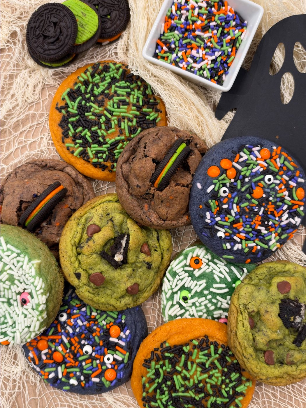 Oh Sweetie Halloween cookies: green Frankenstein cookies, chocolate funfetti cookies with Oreos, and sprinkle cookies with candy eyeballs